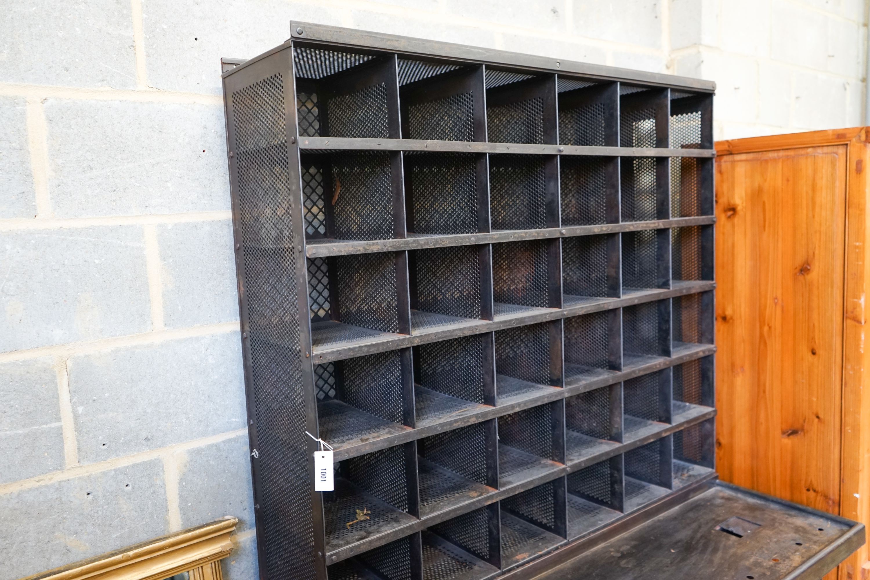 A Royal Mail metal mail sorting unit with integral seat, width 125cm, depth 71cm, height 191cm